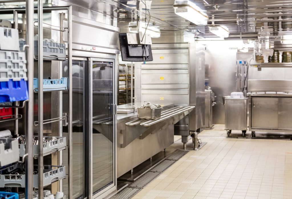 Commercial kitchen with commercial refrigerators.